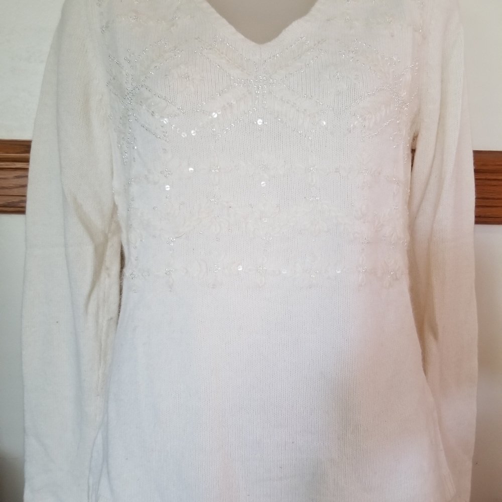 White/cream colored with beaded sweater